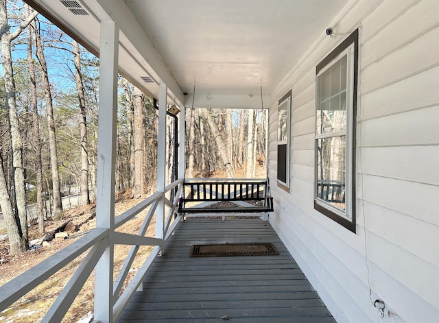 wooden deck featuring a porch