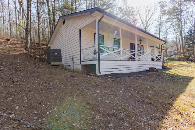 view of front of house featuring covered porch and central air condition unit