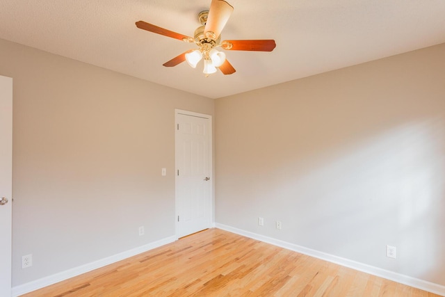 empty room featuring ceiling fan and wood-type flooring