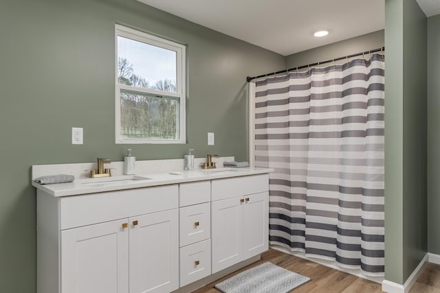 bathroom with vanity and hardwood / wood-style floors