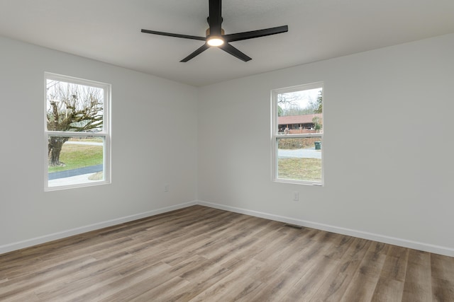 unfurnished room featuring ceiling fan and light hardwood / wood-style flooring