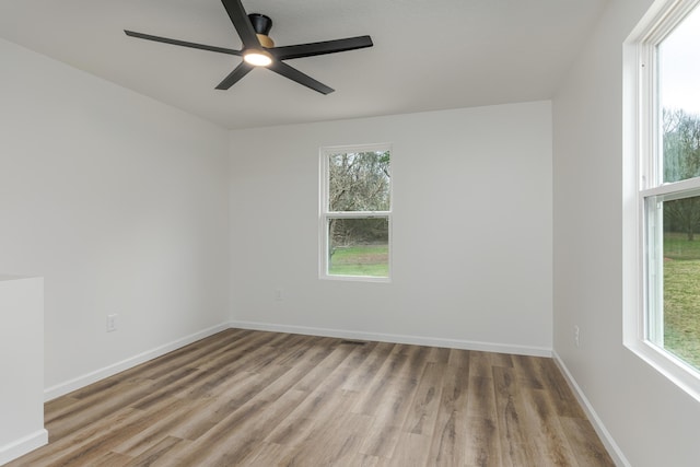 unfurnished room featuring light wood-type flooring and ceiling fan