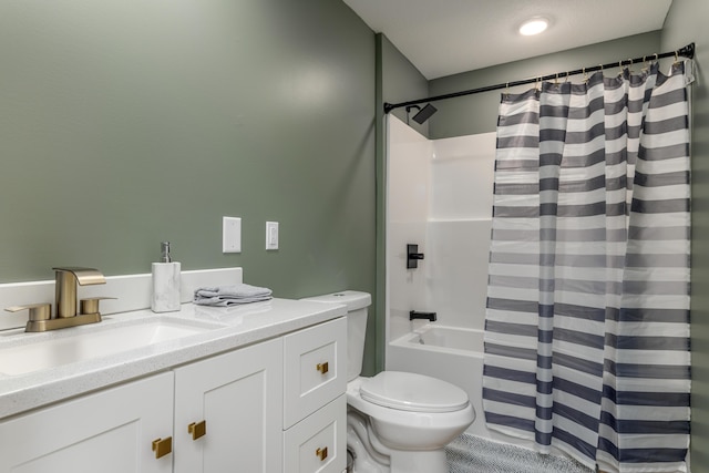 full bathroom featuring toilet, vanity, and shower / bath combination with curtain