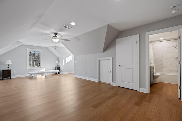 bonus room with visible vents, baseboards, ceiling fan, vaulted ceiling, and wood finished floors