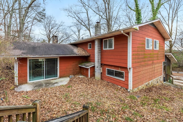 view of side of property with a patio area