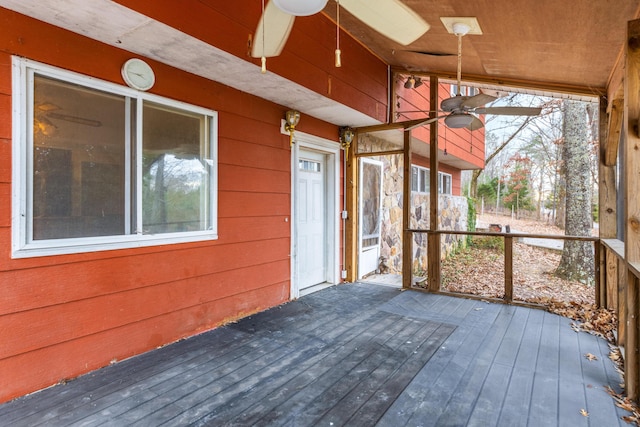 wooden deck featuring ceiling fan