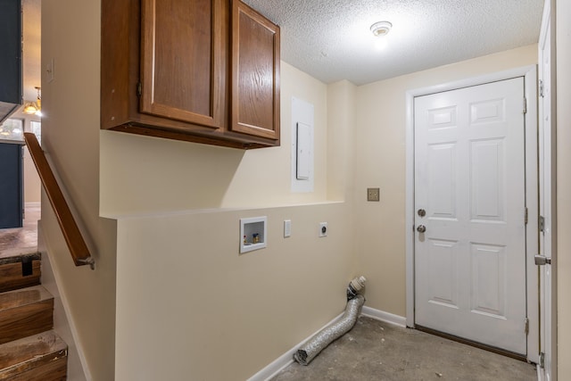 clothes washing area with cabinets, electric panel, washer hookup, a textured ceiling, and hookup for an electric dryer