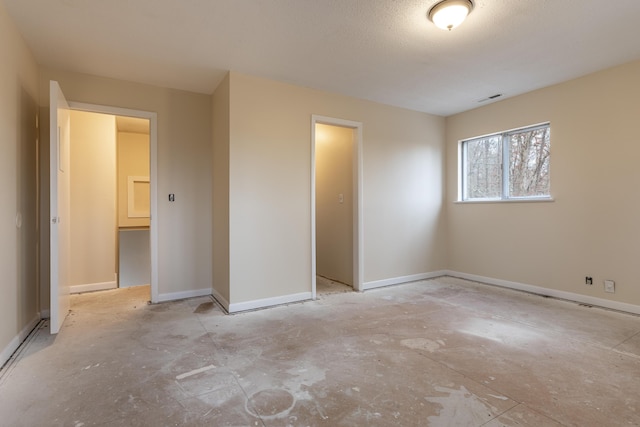 unfurnished bedroom with a spacious closet and a closet