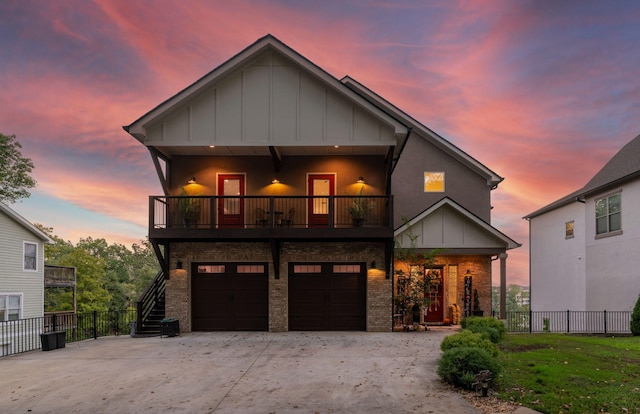 view of front of house with a balcony and a garage