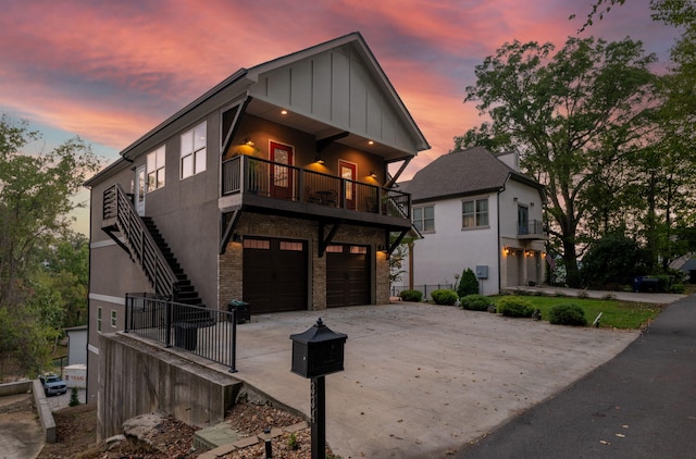 contemporary home with a balcony and a garage