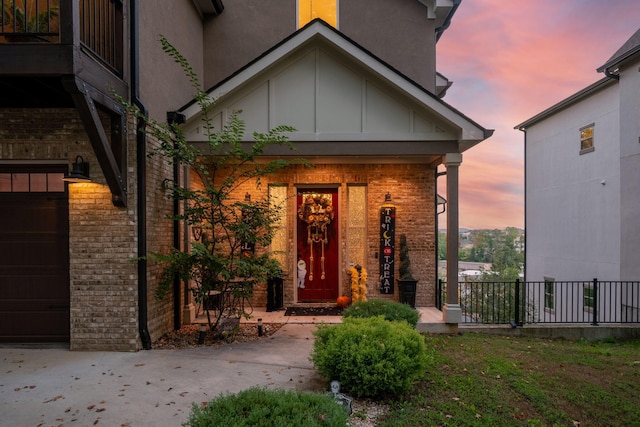 view of exterior entry at dusk