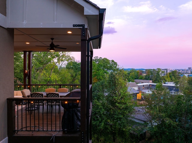 deck at dusk with ceiling fan