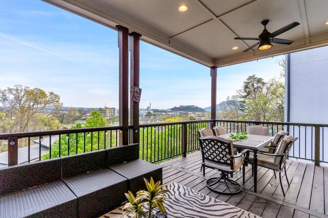 wooden deck featuring ceiling fan