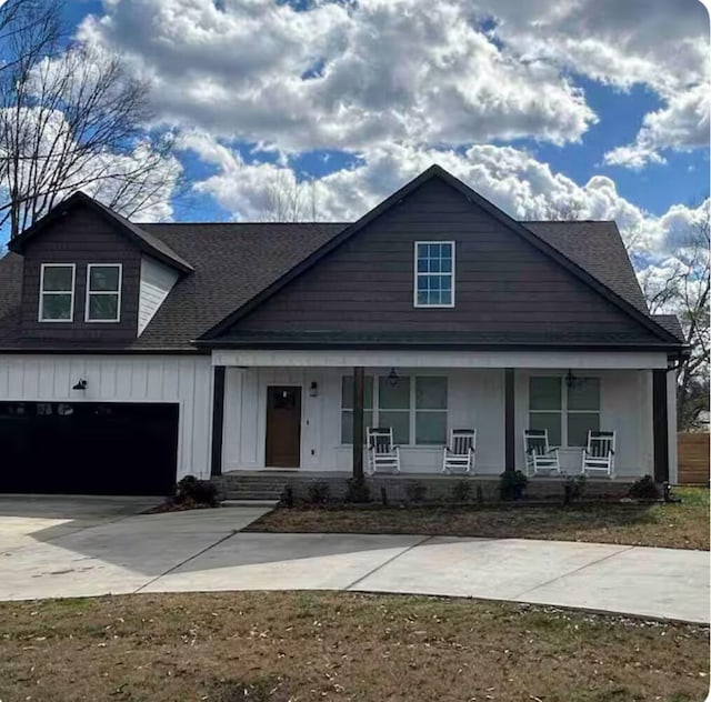 view of front of house with a porch and a garage