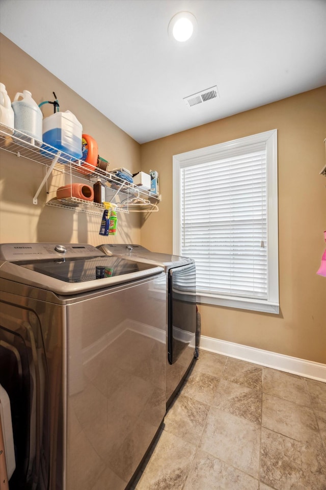 washroom featuring washer and dryer