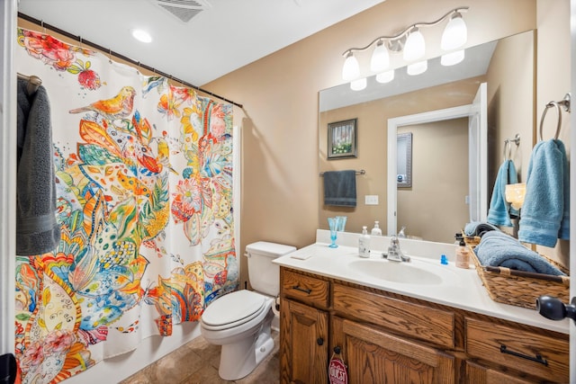 full bathroom with tile patterned floors, vanity, shower / bath combination with curtain, and toilet