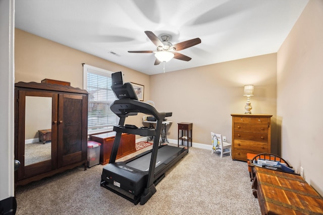 workout area featuring carpet floors and ceiling fan