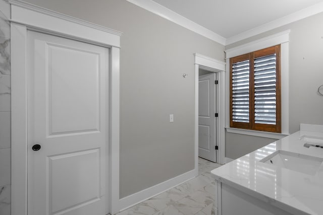 washroom with crown molding and sink