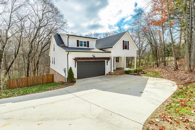 view of front of property featuring a porch and a garage