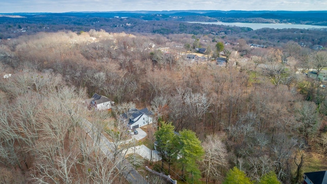 birds eye view of property with a water and mountain view