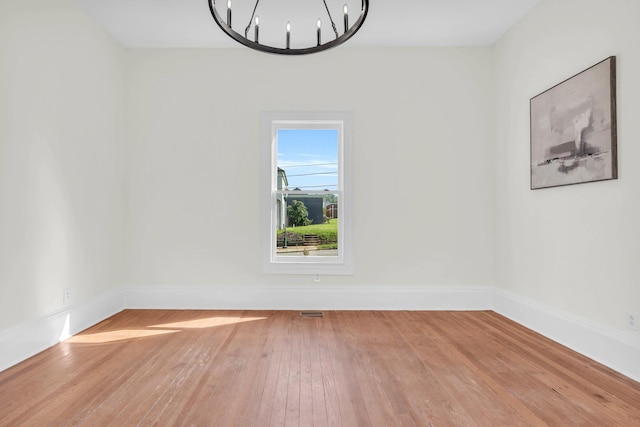 802 E Martin Luther King Blvd, Chattanooga, TN 37403 - unfurnished dining area featuring hardwood / wood-style floors and a chandelier