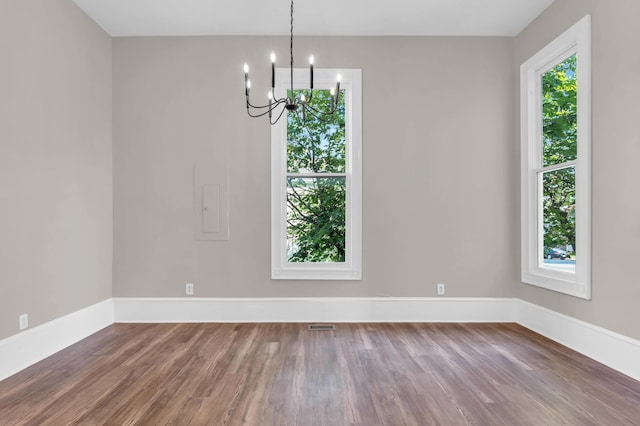 802 E Martin Luther King Blvd, Chattanooga, TN 37403 - spare room featuring a chandelier and wood finished floors
