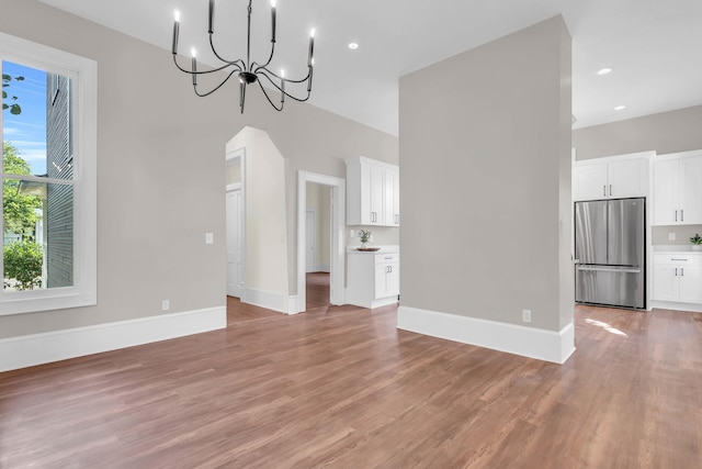 802 E Martin Luther King Blvd, Chattanooga, TN 37403 - unfurnished living room featuring light wood-style floors, a chandelier, and recessed lighting