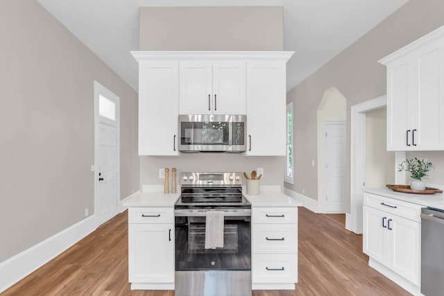 802 E Martin Luther King Blvd, Chattanooga, TN 37403 - kitchen featuring appliances with stainless steel finishes, light countertops, and light wood-style flooring