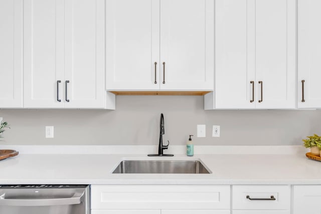 802 E Martin Luther King Blvd, Chattanooga, TN 37403 - kitchen with dishwasher, light countertops, and white cabinetry
