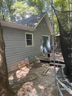 exterior space featuring a wooden deck