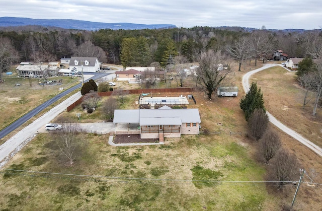 birds eye view of property with a mountain view