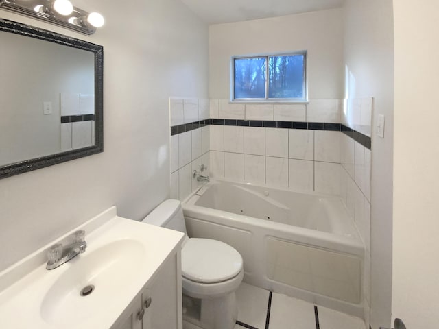 bathroom with a tub, tile patterned flooring, vanity, and toilet