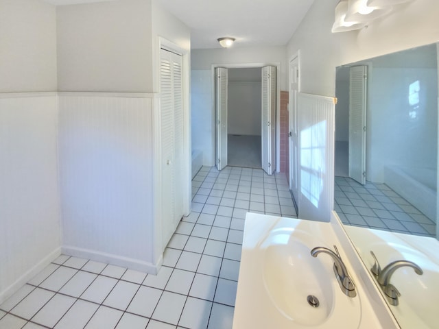 bathroom with tile patterned floors and sink