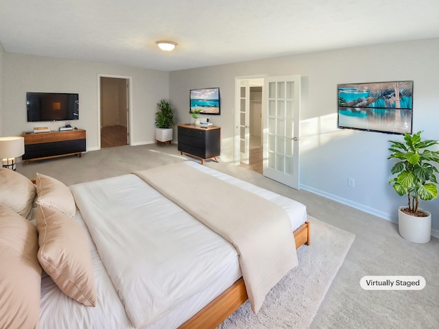 bedroom featuring a spacious closet, carpet floors, and a closet