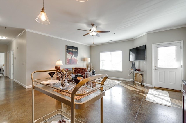 dining space with ceiling fan and crown molding