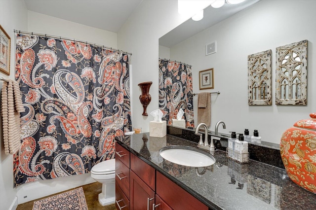 bathroom with tile patterned floors, vanity, and toilet