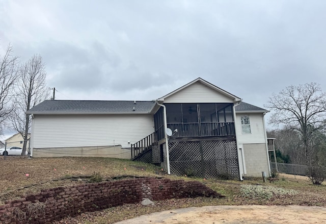 back of property featuring a sunroom