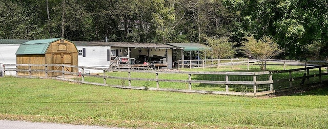 exterior space with a front yard and a storage unit