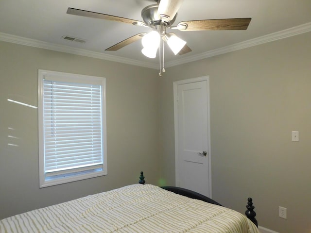 bedroom featuring ceiling fan and ornamental molding