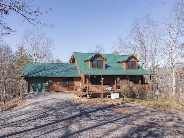 log-style house featuring a porch