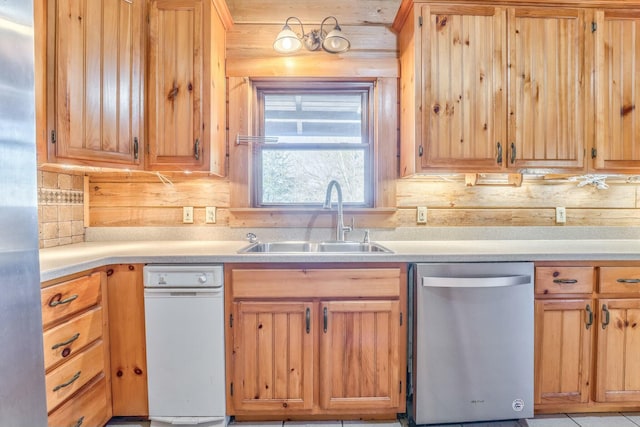 kitchen with stainless steel appliances, wood walls, sink, and backsplash