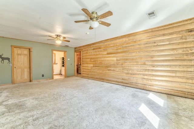 interior space featuring ceiling fan and carpet floors