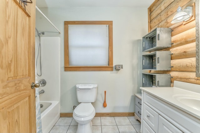 full bathroom featuring toilet, wood walls, shower / bath combination, tile patterned floors, and vanity