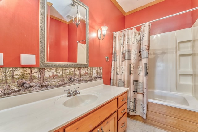 bathroom featuring vaulted ceiling, tasteful backsplash, tile patterned floors, shower / bath combo with shower curtain, and vanity