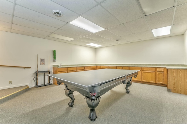 game room featuring light colored carpet and a paneled ceiling