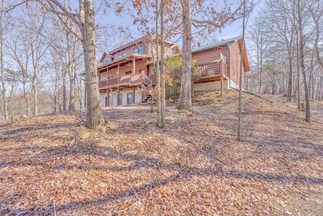 rear view of property with a deck