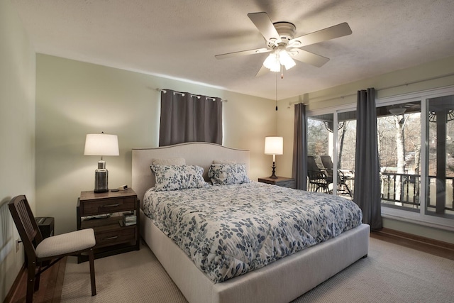 carpeted bedroom featuring access to outside and ceiling fan