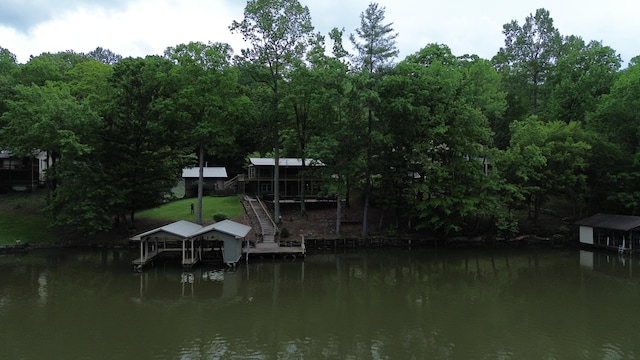 view of dock featuring stairway, a water view, and boat lift