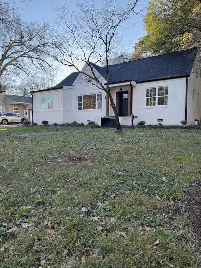 ranch-style house with a front yard