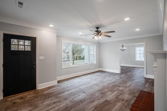 entryway featuring ceiling fan with notable chandelier, dark hardwood / wood-style flooring, and crown molding